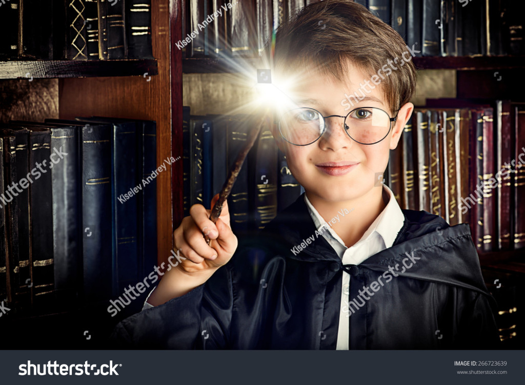 stock-photo-a-boy-stands-with-magic-wand-in-the-library-by-the-bookshelves-with-many-old-books-fairy-tales-266723639